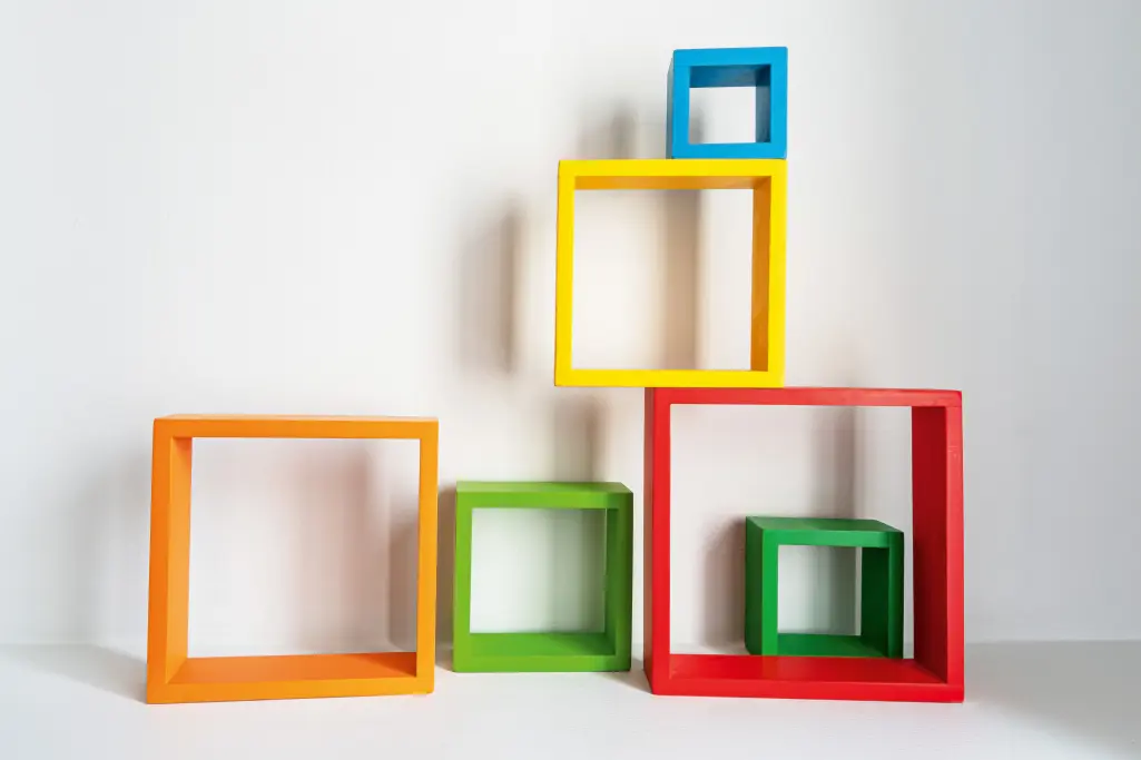 Colourful wooden cubes in various sizes