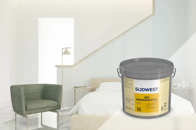 bright, modern bedroom with bed and armchair